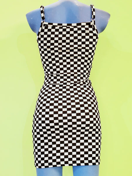 black and white checker print bodycon mini dress with spaghetti straps. shown back view on a blue mannequin