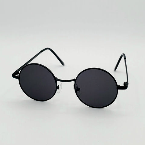 1 1/4” round sunglasses with thin black metal frames and black lenses