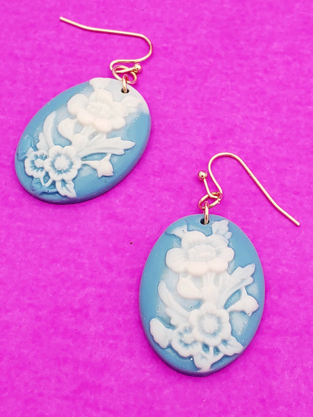 dangle earrings with acrylic floral cameo relief style charms in pale blue and white.