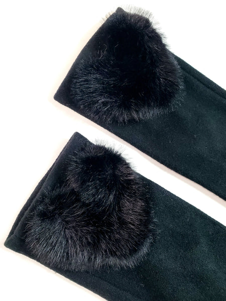 Pair of black knit gloves with matching soft faux fur heart-shaped cuff detail, showing cropped close up of hearts