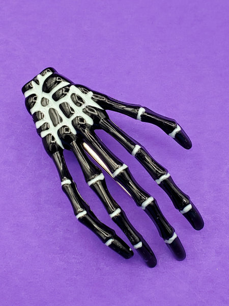 black plastic with white painted details skeleton hand hair clip