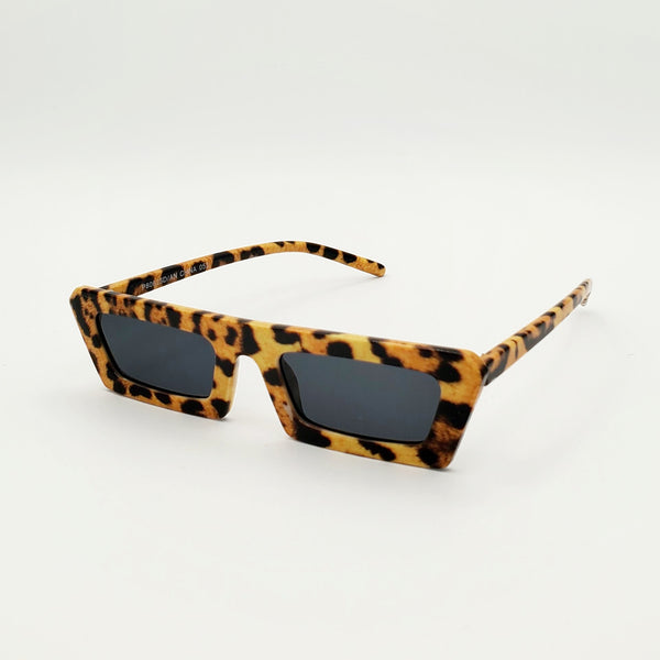 80s style narrow flat bridge photorealistic leopard print plastic frame sunglasses with dark smoke lens, shown 3/4 view