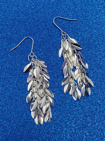 pair of dangle earrings made of stacks of small silver metal leaves