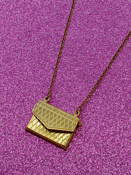 shaped crosshatch patterned locket necklace on link chain