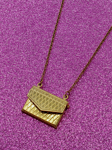 shaped crosshatch patterned locket necklace on link chain