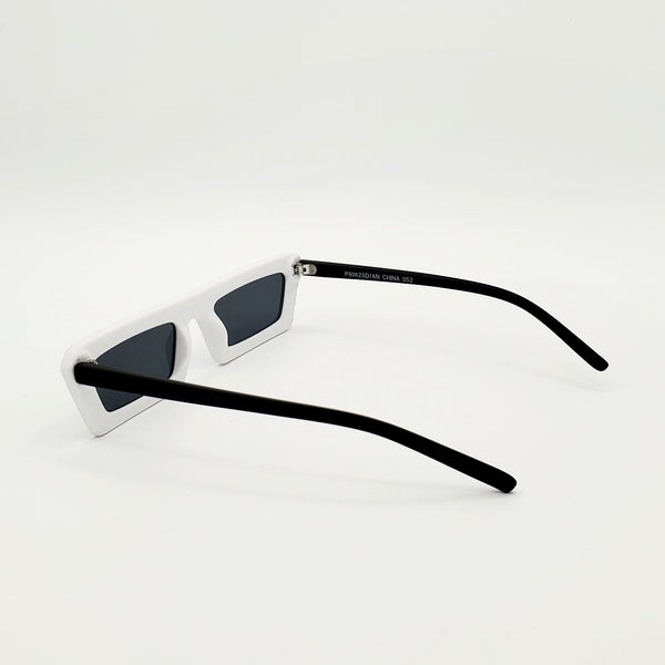 80s style narrow flat bridge matte finish black and white snake print plastic frame sunglasses with solid black arms, showing reverse in 3/4 view