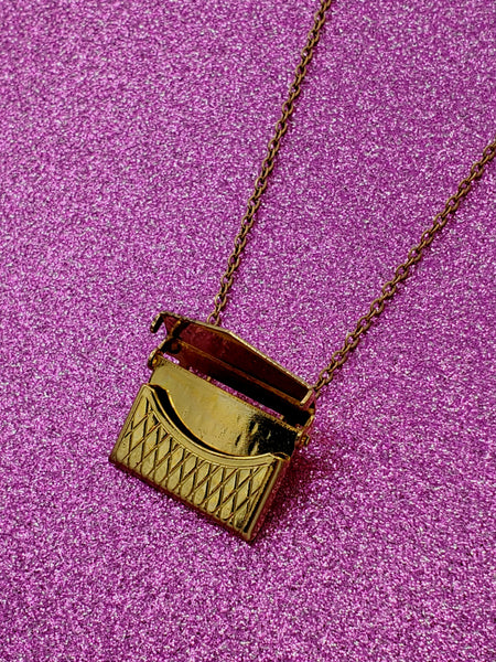 shaped crosshatch patterned locket necklace on link chain, shown open