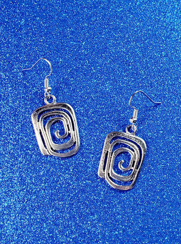 A pair of dangle earrings with silver metal square spiral charms 