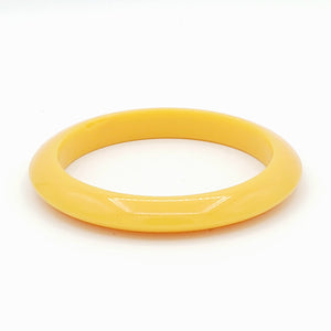 straw yellow resin spacer bangle with tapered shape