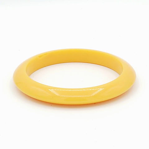 straw yellow resin spacer bangle with tapered shape