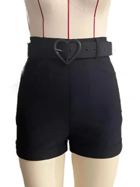 black bengaline high-waisted shorts with cuffs, front pockets, and a faux black leather belt with a heart shaped black buckle. Shown from the front on a dress form