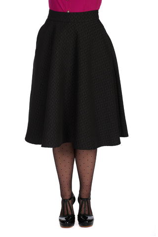 high waist swing skirt in a black-on-black all-over woven checkered heart pattern with both a matte finish and slightly raised satin finish. shown from the waist down on a model