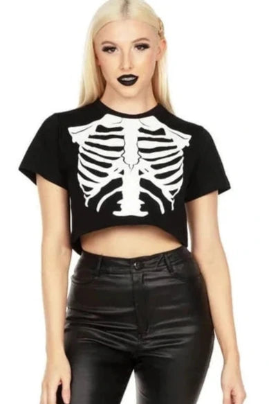 Person wearing a black skeleton t-shirt and black leather pants on a white background