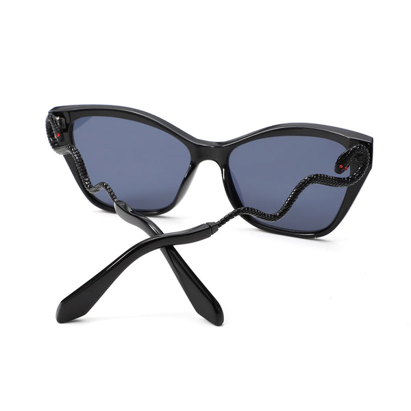 shiny black plastic frame cat eye sunglasses with dark smoke lens and black metal arms shaped like a curvy snake with red jeweled eyes