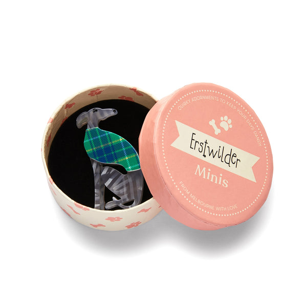 Dog Minis Collection "Garrison the Greyhound" sitting grey dog wearing plaid sweater layered resin brooch, shown in illustrated round box packaging