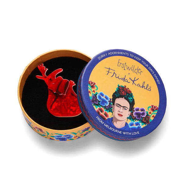 Frida Kahlo Collection “Memory (The Heart)” red anatomical heart layered resin brooch, shown in illustrated round box packaging