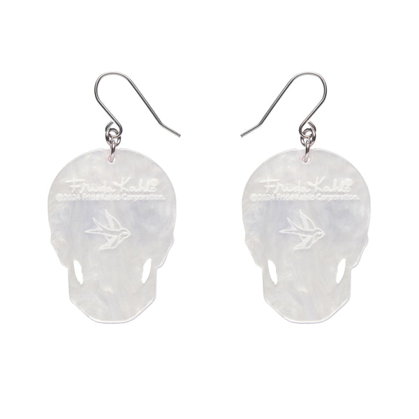 pair of Frida Kahlo Collection “Dia De Los Muertos” layered resin calavera skull dangle earrings, showing white backing layer