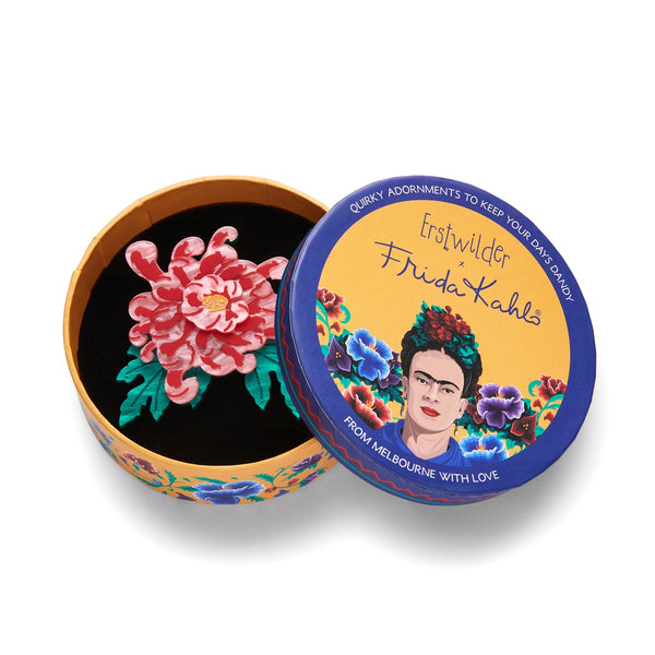 Frida Kahlo Collection “Passion is a Bridge” pink chrysanthemum blossom and green leaves layered resin flower brooch, shown in illustrated round box packaging