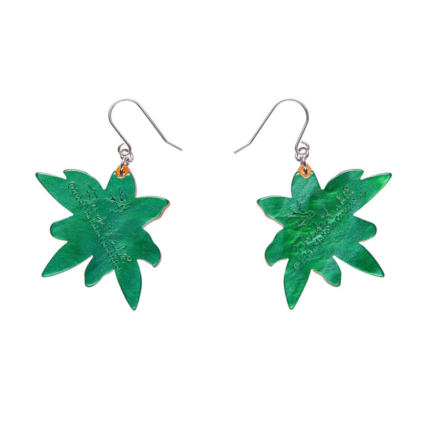 pair Frida Kahlo Collection “Strange As You” orange tiger lily blossom and green leaves layered resin dangle earrings, showing green backing layer view