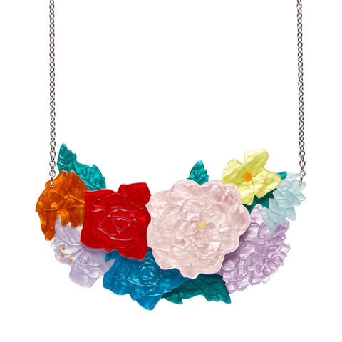 Frida Kahlo Collection “Declaración Floral” layered resin pendant necklace, comprised of white, yellow, red, orange, blue, and lavender assorted flowers and green leaves on silver metal link chain