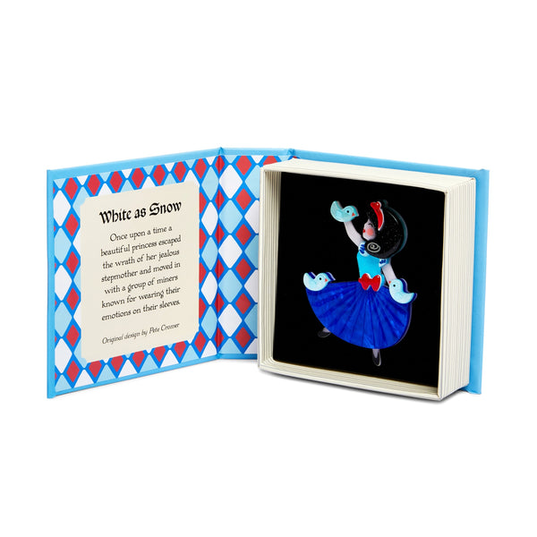 Pete Cromer x Erstwilder Fairy Tales collaboration collection "White as Snow" Snow White character wearing blue dress layered resin brooch, shown in illustrated book-shaped box packaging