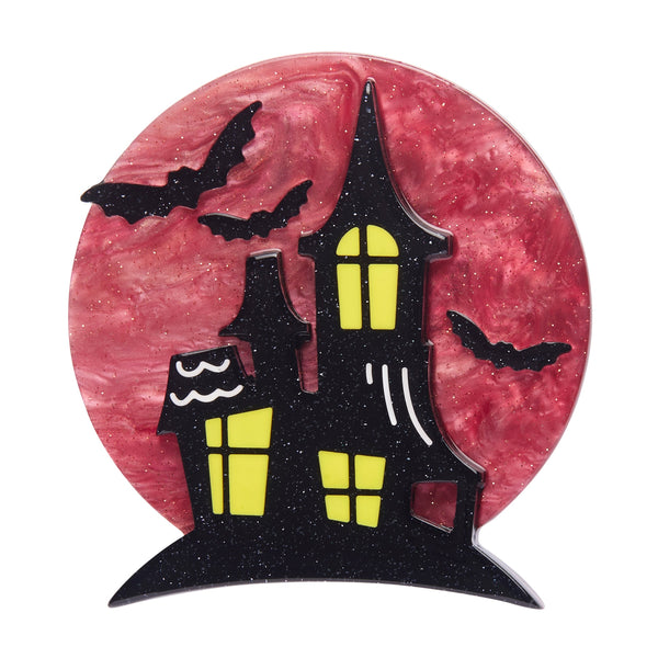 spooky black mansion silhouetted against a ruby full moon "On Haunted Hill" layered acrylic resin brooch