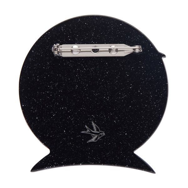 spooky black mansion silhouetted against a ruby full moon "On Haunted Hill" layered acrylic resin brooch, showing glitter black back with silver metal pin clasp