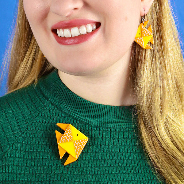 Origami Collection "The Memorable Goldfish" layered resin brooch, shown on model wearing matching earring