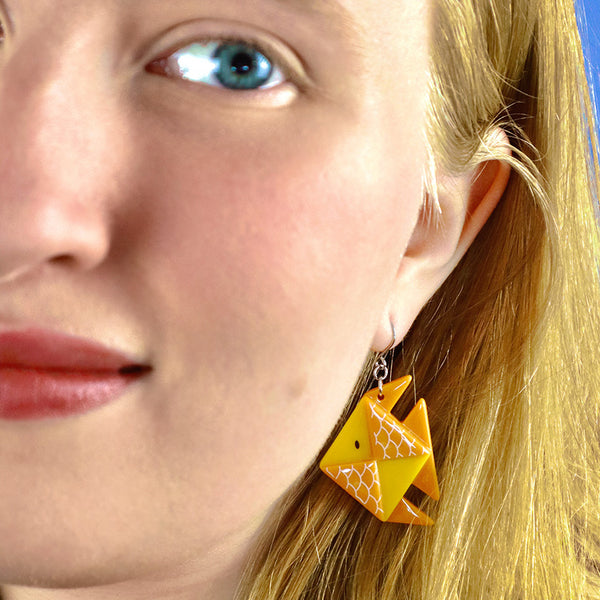 Origami Collection "The Memorable Goldfish" layered resin dangle earring, shown on model