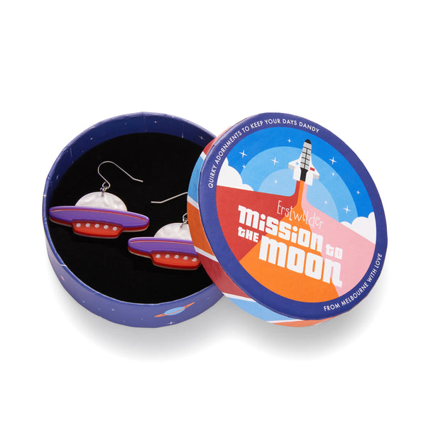 Mission to the Moon Collection "Beam Me Up” layered resin flying saucer dangle earrings, shown in illustrated round box packaging