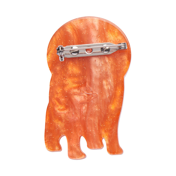 Mission to the Moon Collection "Interplanetary Pug” layered resin cosmonaut canine brooch, showing view of pearly orange back