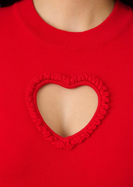 Bright red short sleeve sweater featuring heart-shaped keyhole cutout at bust, shown in close up of keyhole