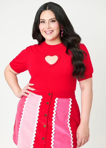 Bright red short sleeve sweater featuring heart-shaped keyhole cutout at bust, shown on a plus size model