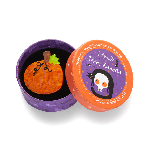 "Midnight Magic Pumpkin" layered resin mini brooch, shown in illustrated round box packaging