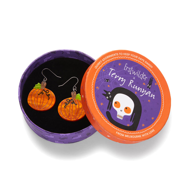 pair "Midnight Magic Pumpkin" layered resin dangle earrings, shown in illustrated round box packaging