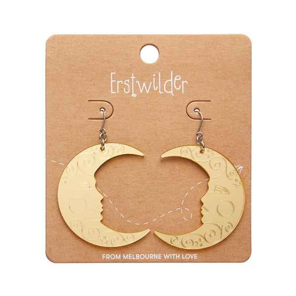 pair Spellbound Essentials Collection crescent moon dangle earrings in shiny etched mirror gold , shown on branded backer card packaging