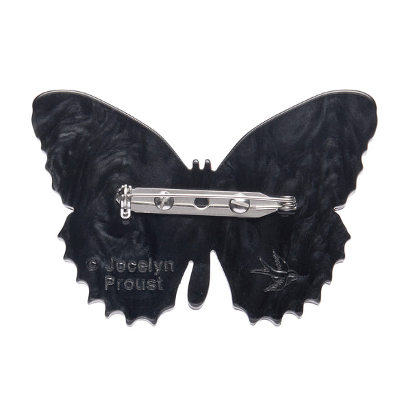 Jocelyn Proust Collaboration Collection "Wings Laced in Red" layered resin butterfly brooch, showing black reverse