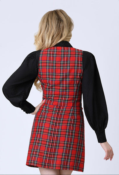model wearing a red plaid vest with vertical seaming, a round neckline, and black button closure. Shown layered with black blouse from back