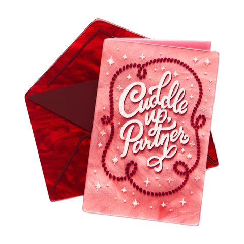 Love Everlasting Shea O'Connor collaboration collection "Cuddle Up Partner" layered resin pink valentine card with "Cuddle Up, Partner" text and red envelope brooch