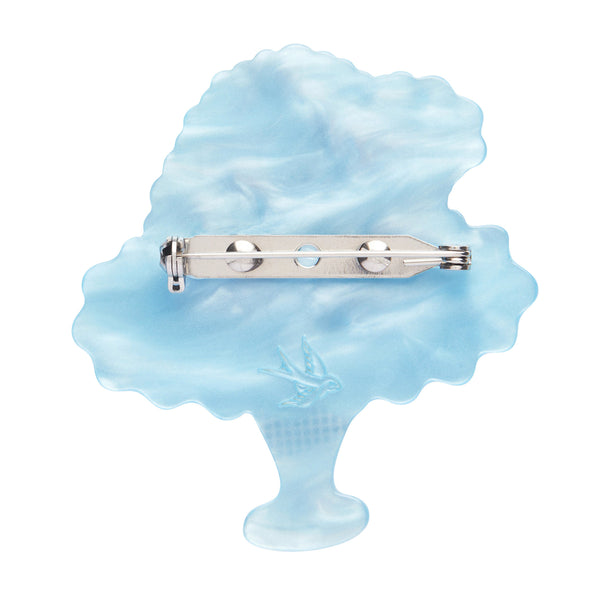 Love Everlasting Shea O'Connor collaboration collection "Piece of Cake" heart-shaped caked on a blue pedestal layered resin brooch, showing solid blue back