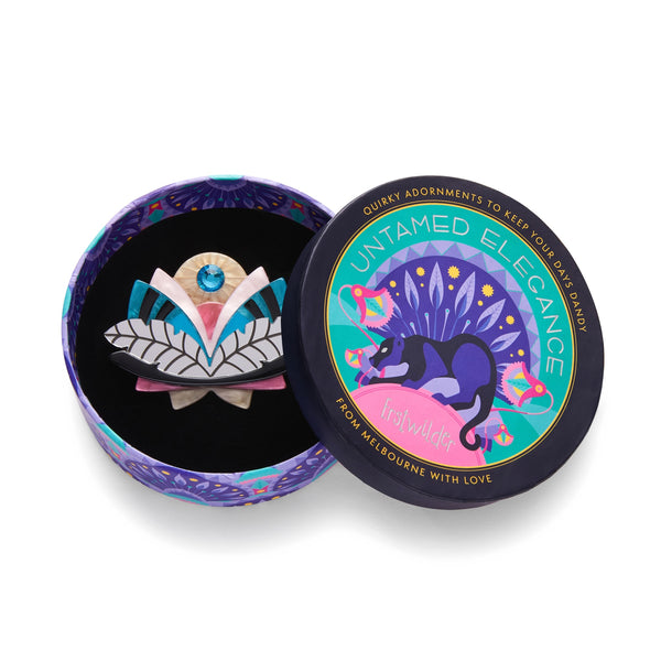 Untamed Elegance Collection "Harmonious Bloom" Art Deco style black, pink, teal, ivory, and mirror finish silver layered resin with blue jewel accent lotus flower brooch, shown in illustrated round box packaging