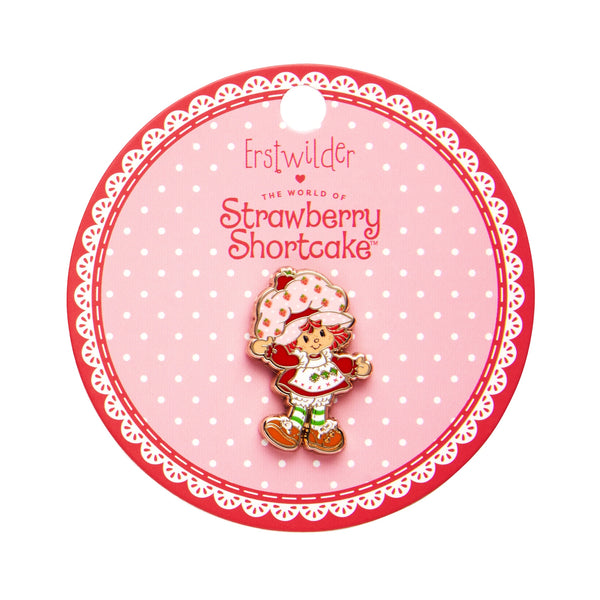 "Strawberry Shortcake" character enameled gold metal clutch back pin, shown on illustrated backer card packaging