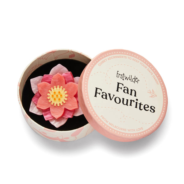 "Lotus Rising" pink flower layered resin brooch, shown in illustrated round box packaging