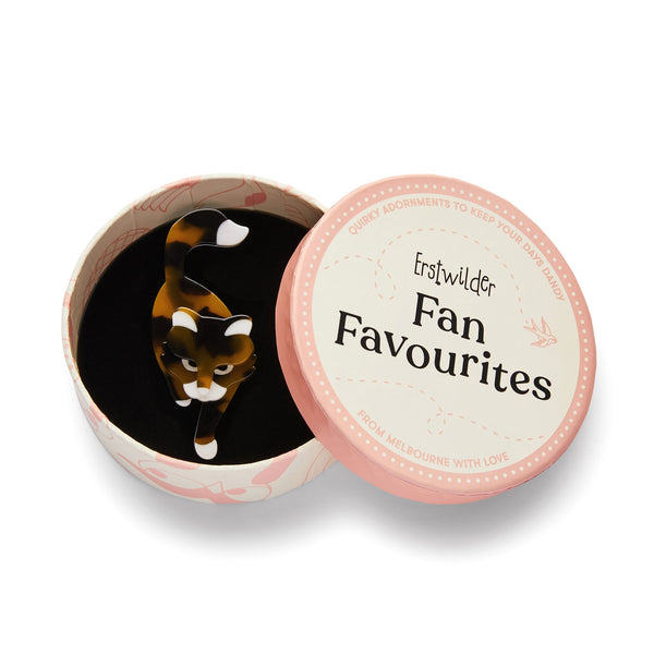 "Meandering Monday" layered resin calico cat brooch, shown in illsutrated round box packaging