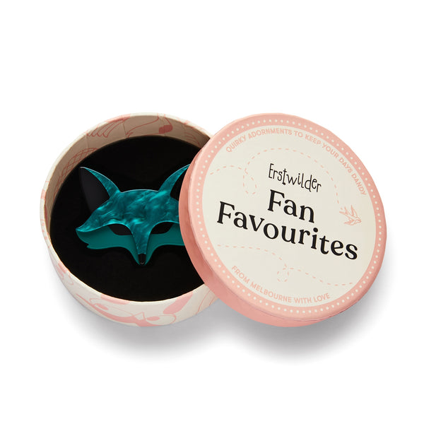 "Fatoush the Fennec Fox" layered resin teal blue fox head brooch, shown in illustrated round box packaging