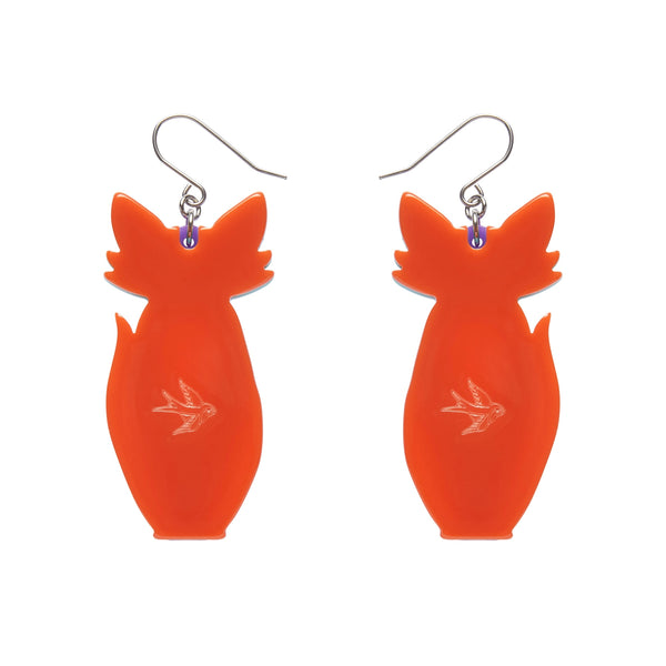 pair "Varuka Fox" orange, white, mint, purple, yellow, and black layered resin sitting fox dangle earrings, showing solid orange back