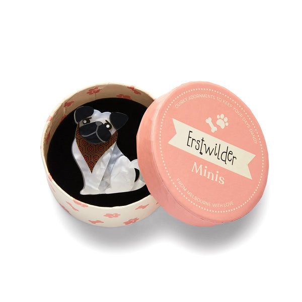 Dog Minis Collection "Adoring Polly Pug" seated white and black pug dog wearing patterned brown bandana layered resin brooch, shown in illustrated round box packaging