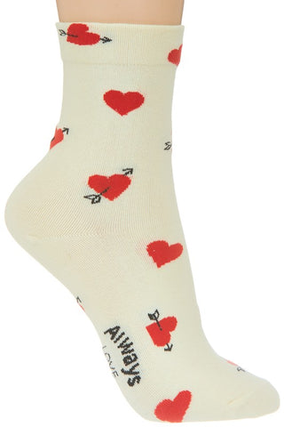 cotton knit ankle socks in creamy off-white with an all-over pattern of red hearts, some of which have been punctured by black arrows