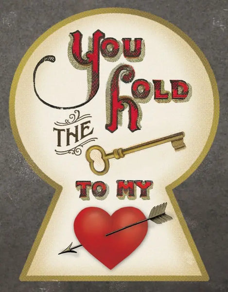 Victorian Era inspired greeting card with the outer rebus message of “You Hold The Key To My Heart” - Key is pictured as a large golden key and Heart is pictured as a large red heart with black arrow through it. Message is shown inside a keyhole shape 