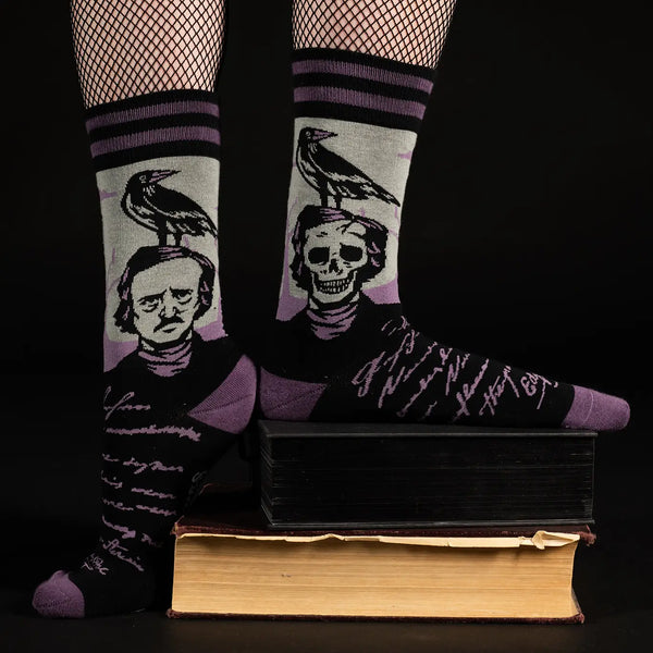 A model standing on a pile of books wearing the socks